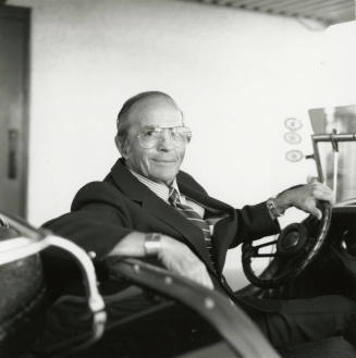 Leonard Monti in his 1966 Excalibur