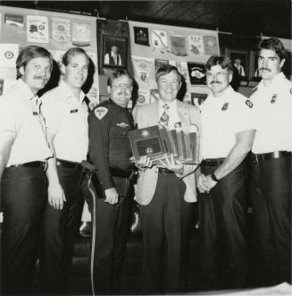 Fistful of plaques, from Tempe Daily News, March 26, 1986