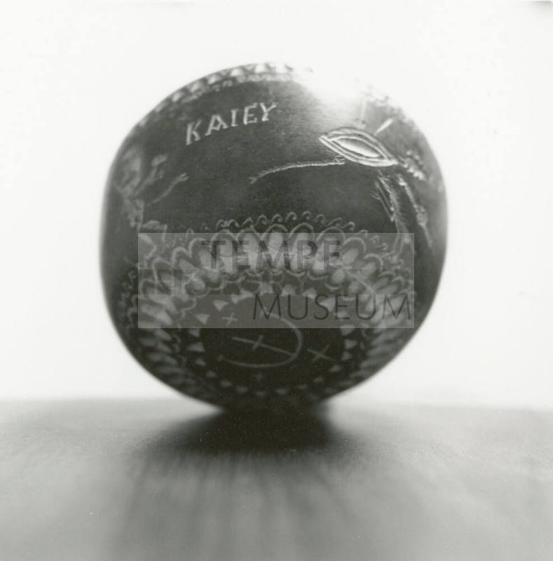 Hand holds small ceramic bowl reading "KAlEY"
