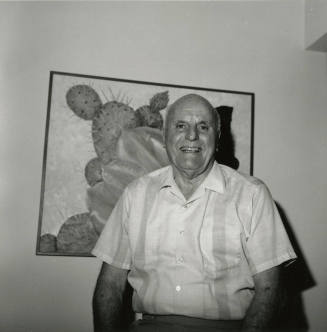 Older man in front of desert plant, cactus painting