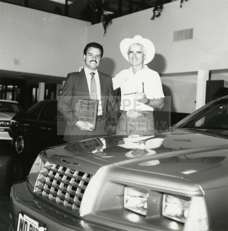 Teen Challenge of Arizona representative presents plaque to Tex Earnhardt