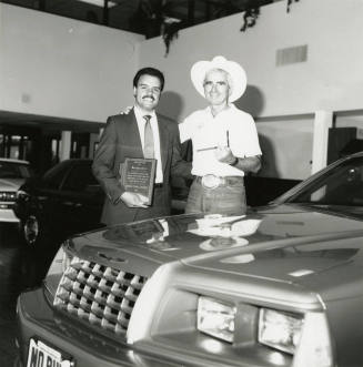 Teen Challenge of Arizona representative presents plaque to Tex Earnhardt
