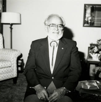 Older man seated in living room
