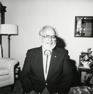 Older man seated in living room
