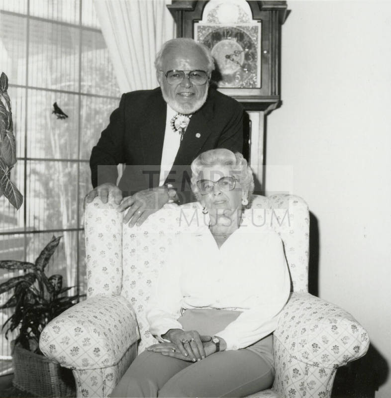 Older man and woman seated in living room