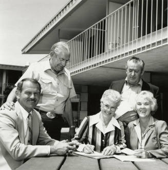 Unidentified Group of 3 Men & 2 Women Signing Papers