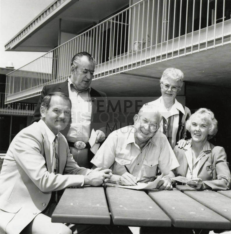 Unidentified Group of 3 Men & 2 Women Signing Papers