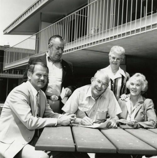 Unidentified Group of 3 Men & 2 Women Signing Papers