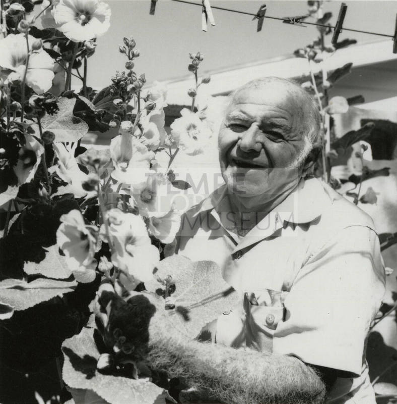 Unidentified Grey-Haired Man & Flowers