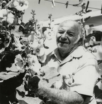 Unidentified Grey-Haired Man & Flowers