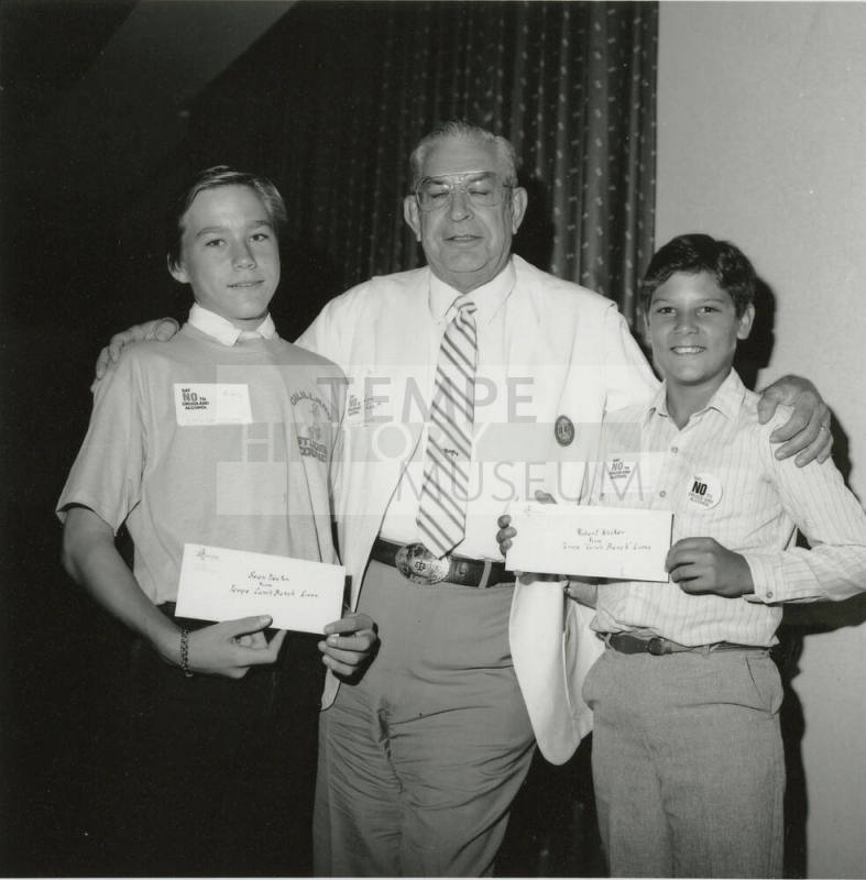 Two young men receive "Say no to drugs and alcohol" awards