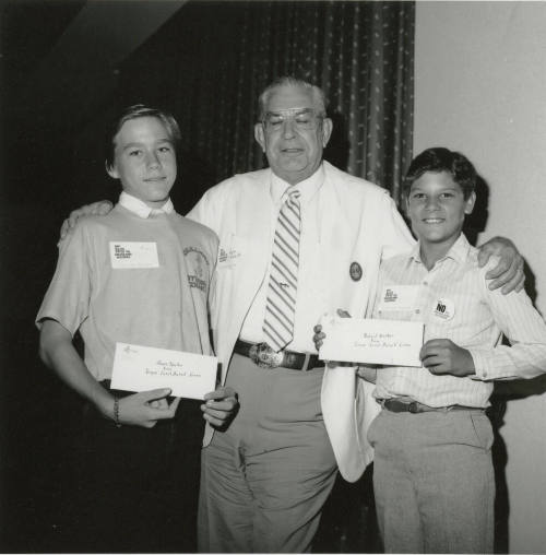 Two young men receive "Say no to drugs and alcohol" awards