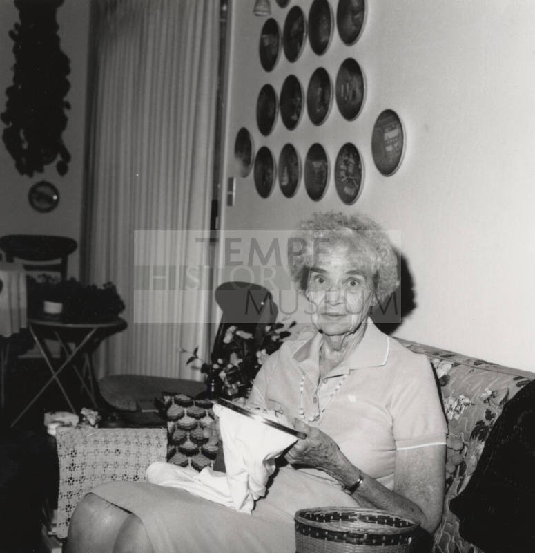 Rayma Neeb needlepoints in her living room