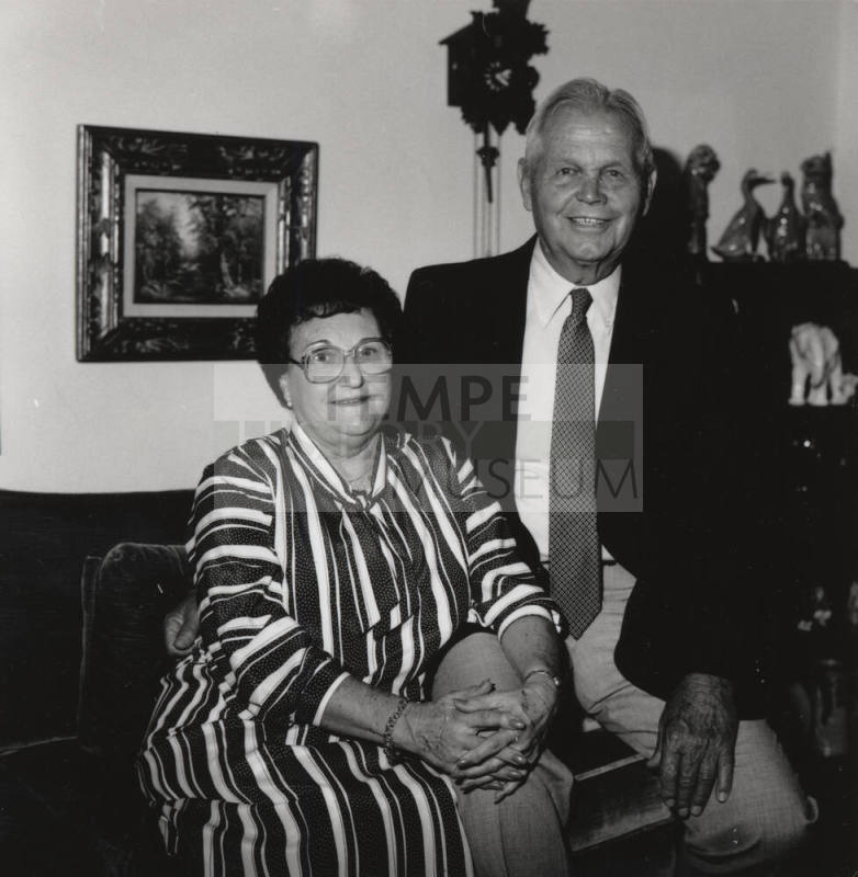 Unidentified couple in living room at home (1 of 2)
