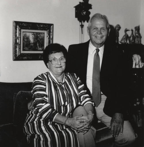 Unidentified couple in living room at home (1 of 2)