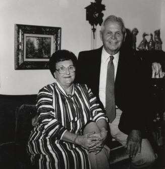 Unidentified couple in living room at home (1 of 2)