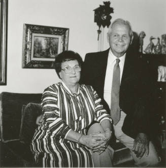 Unidentified couple in living room at home (2 of 2)