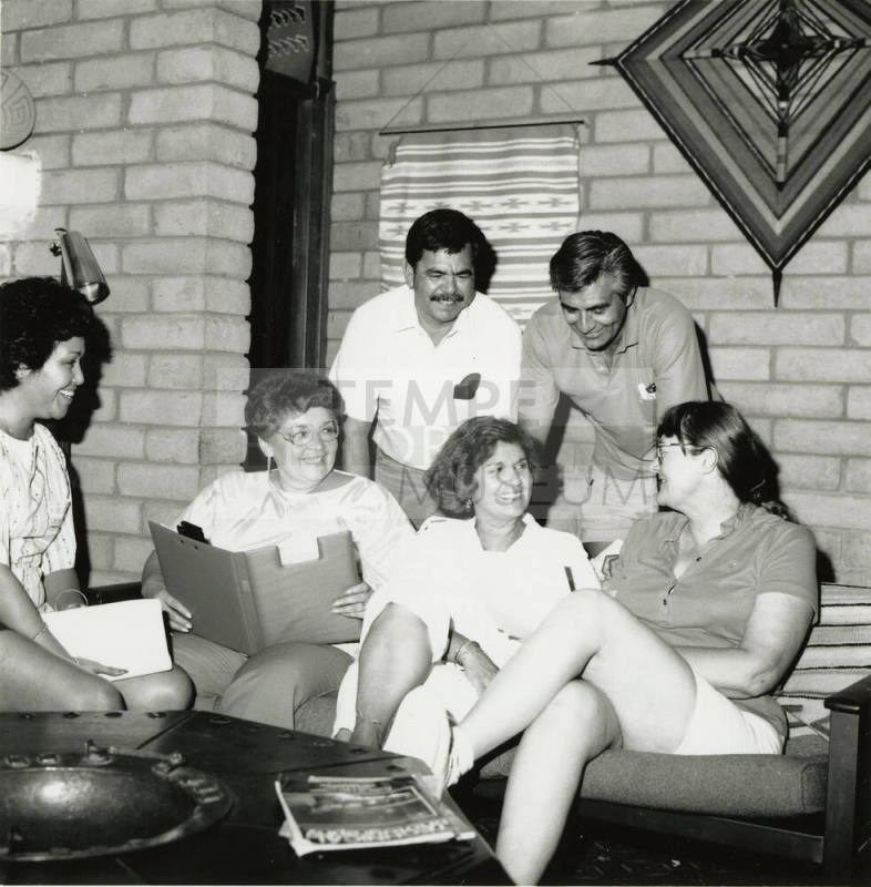 Unidentified group of 4 women & 3 men in discussion