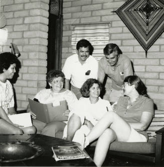 Unidentified group of 4 women & 3 men in discussion