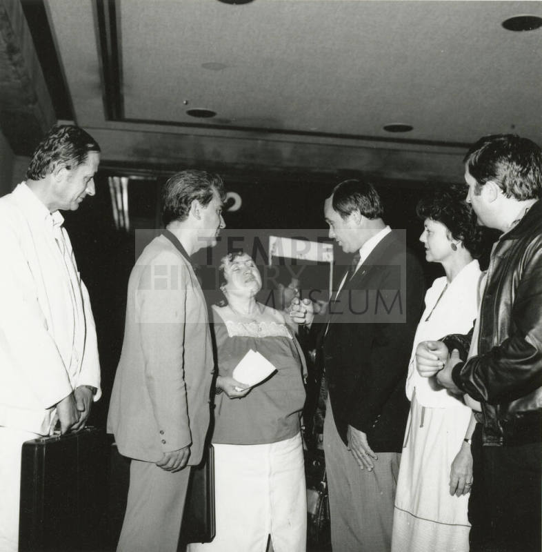 A group of people talking.