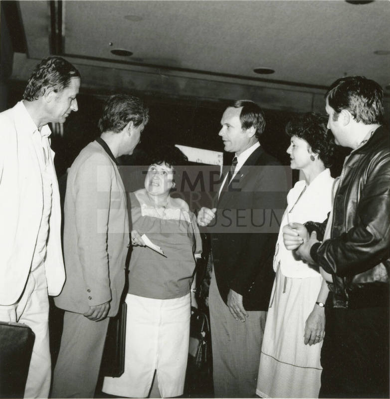 A group of people talking.