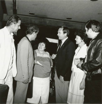 A group of people talking.