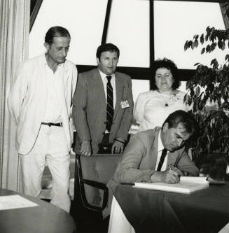 Signing the papers.