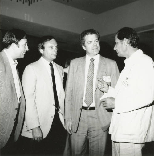 Group of men talking.