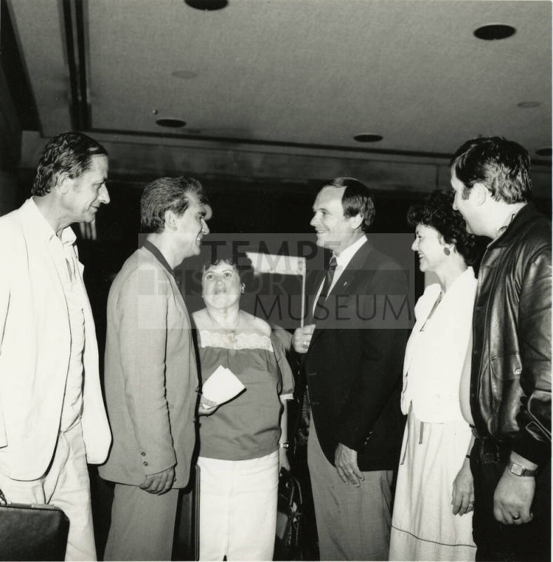 A group of people talking.
