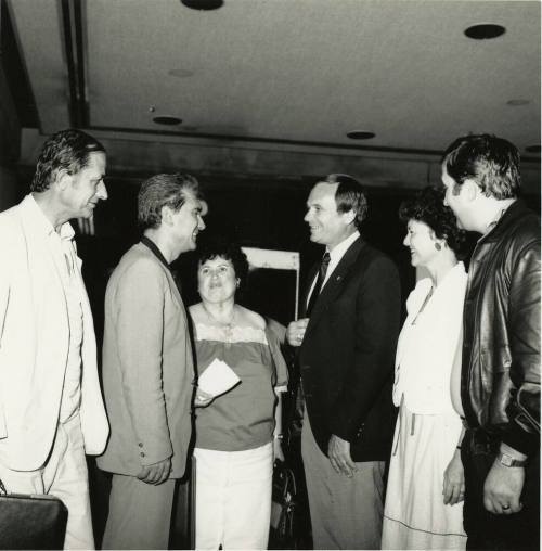 A group of people talking.