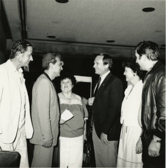 A group of people talking.