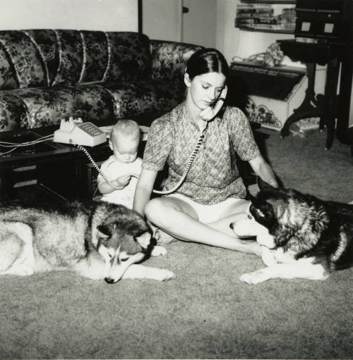 Woman sitting with family.