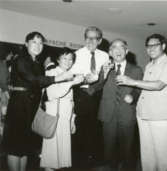 Group of people standing around.