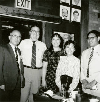 Group of people standing around.