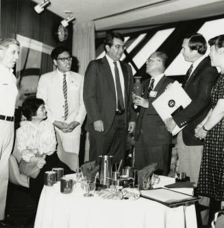 Group of people standing around.