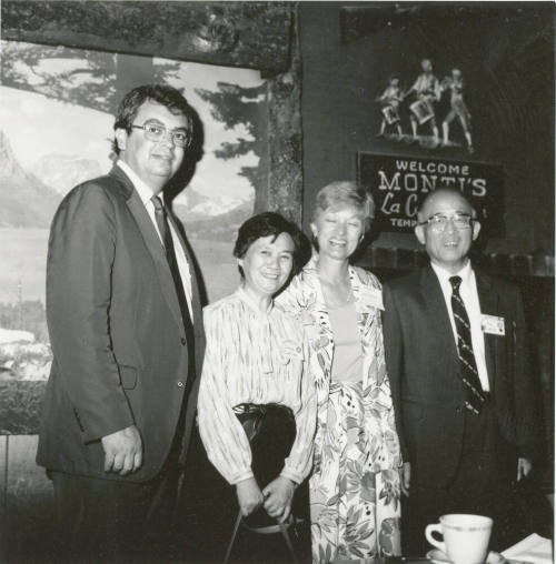 Group of people standing around.