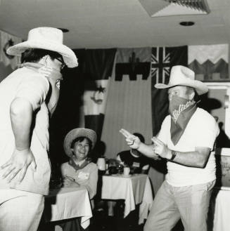 Grown men playing cowboys.