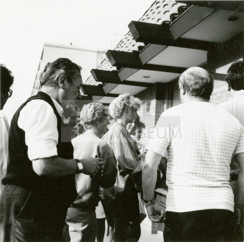 A group of people standing around.
