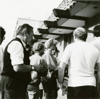 A group of people standing around.
