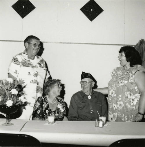 Four unidentified people at a table