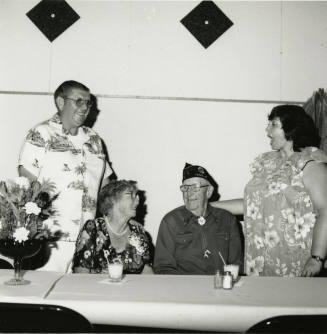 Four unidentified people at a table