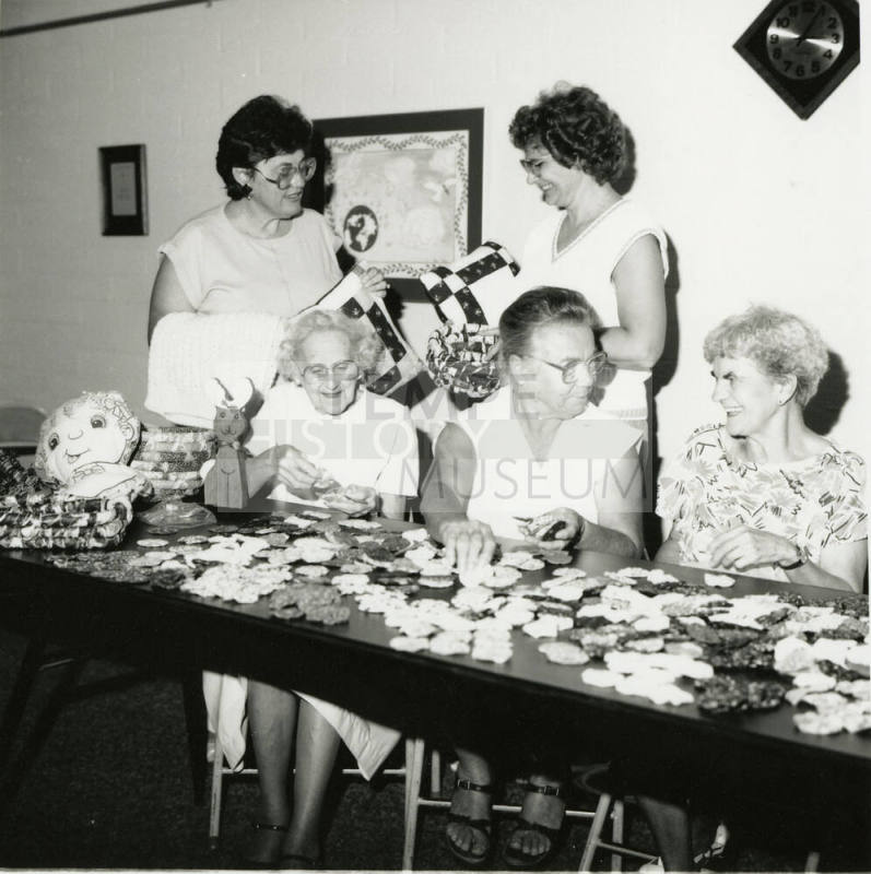 Five unidentified ladies at a craft table