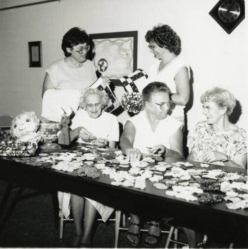 Five unidentified ladies at a craft table
