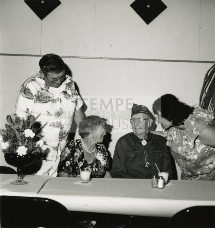 Four unidentified people at a table
