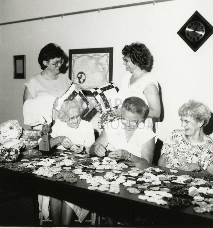 Five unidentified ladies at a craft table
