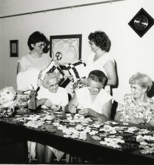 Five unidentified ladies at a craft table