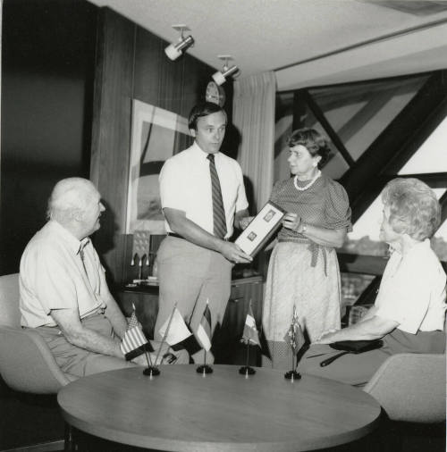 Mayor Mitchell Presents a Plaque to Unidentified Woman