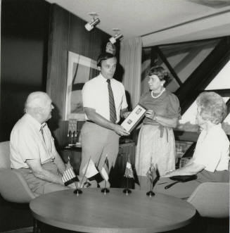 Mayor Mitchell Presents a Plaque to Unidentified Woman