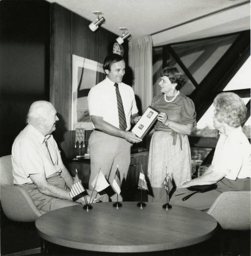 Mayor Mitchell Presents a Plaque to Unidentified Woman