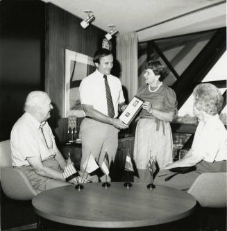 Mayor Mitchell Presents a Plaque to Unidentified Woman